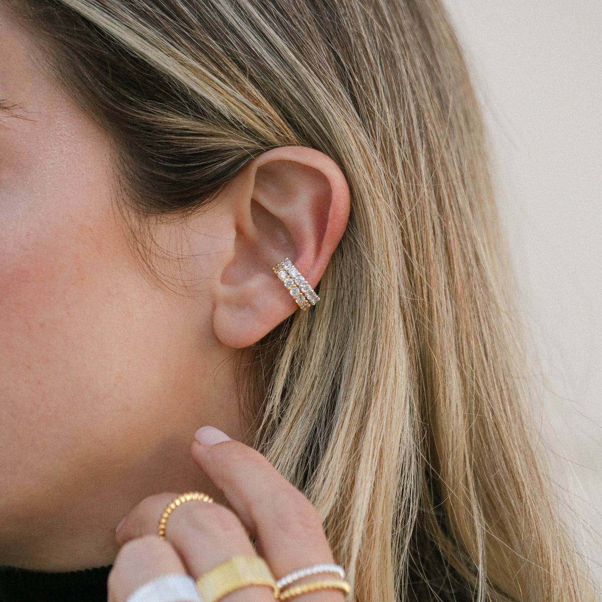 Charlotte Ear Cuff shown in gold-plated and silver finishes on ear