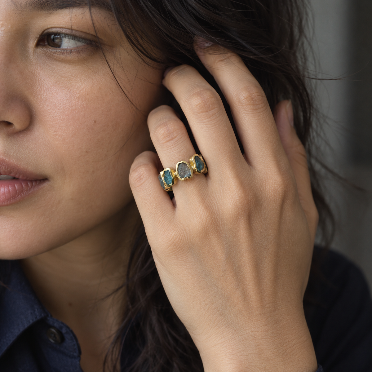 Deformed Apatite Ring worn on model - close-up