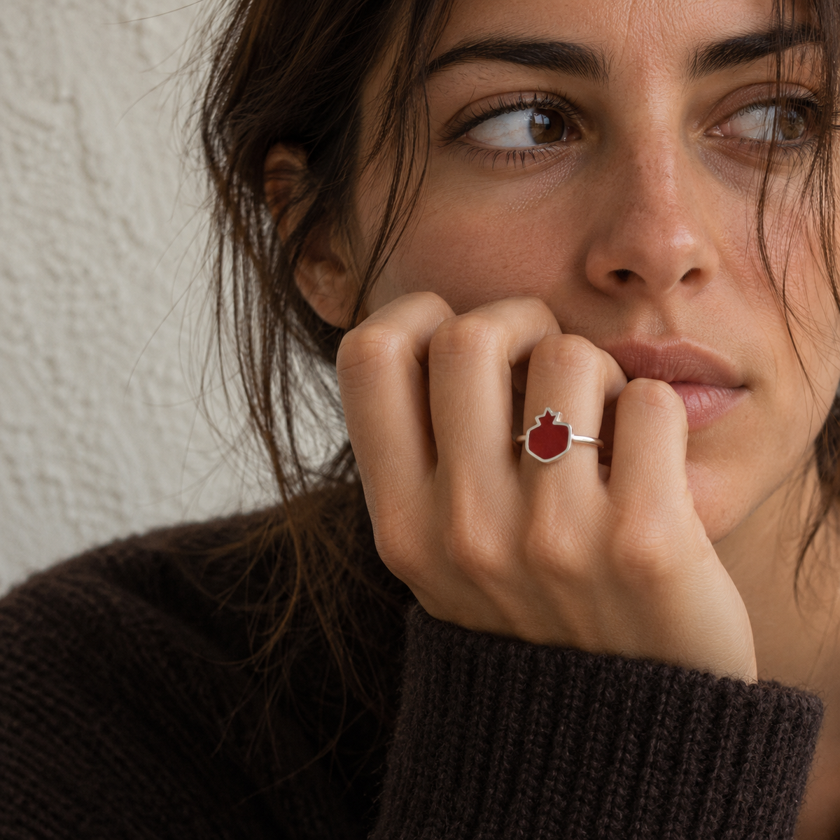 Model wearing the red resin pomegranate silver ring