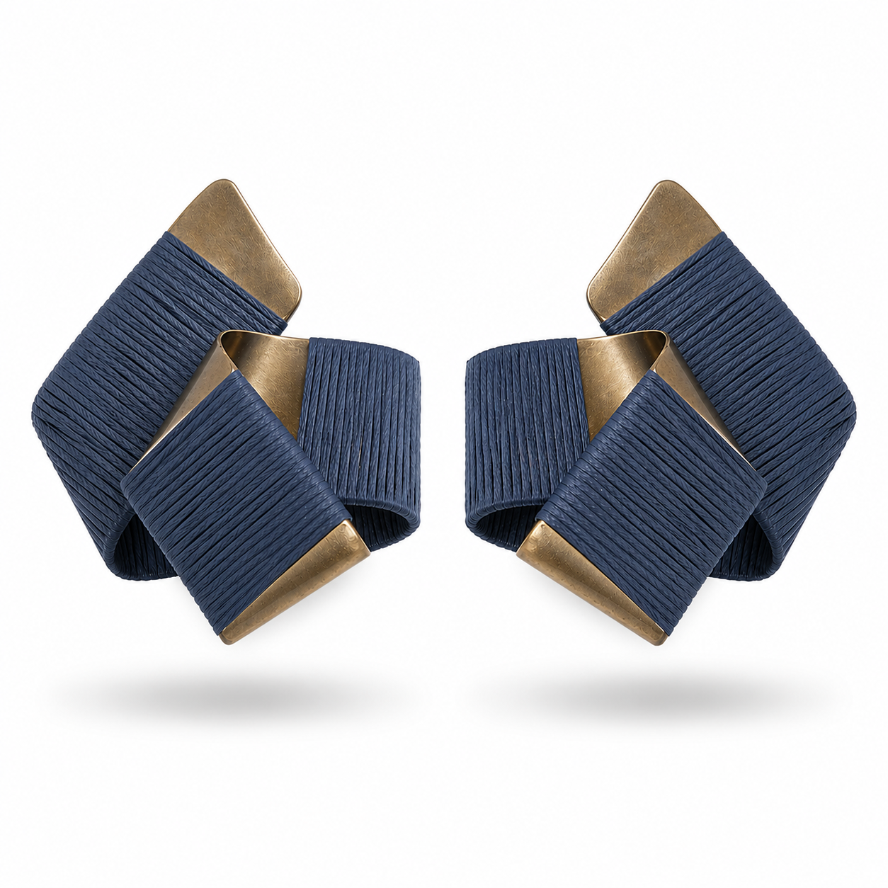 Pair of blue and gold earrings on a white background