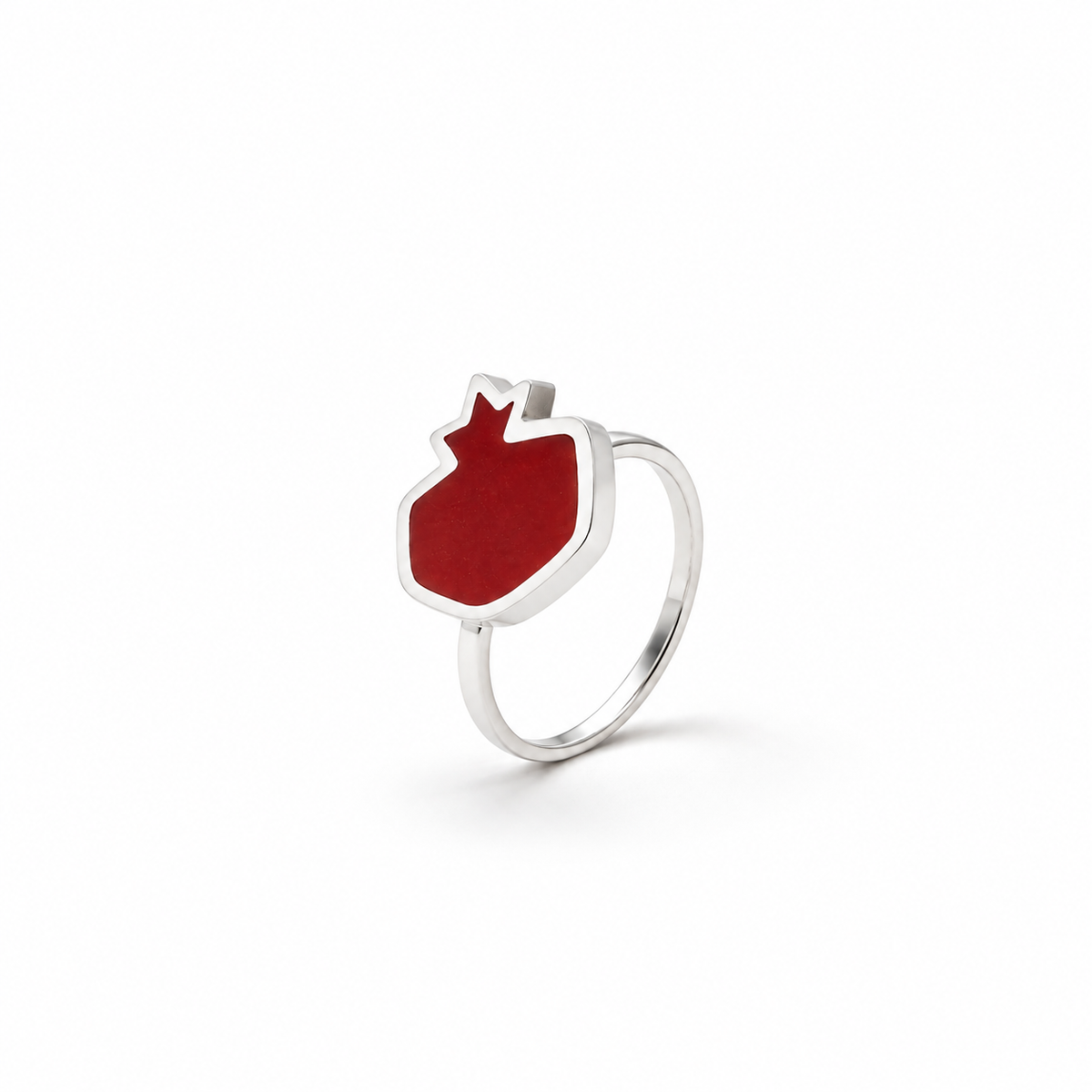 Pomegranate sterling silver ring with red resin on white background